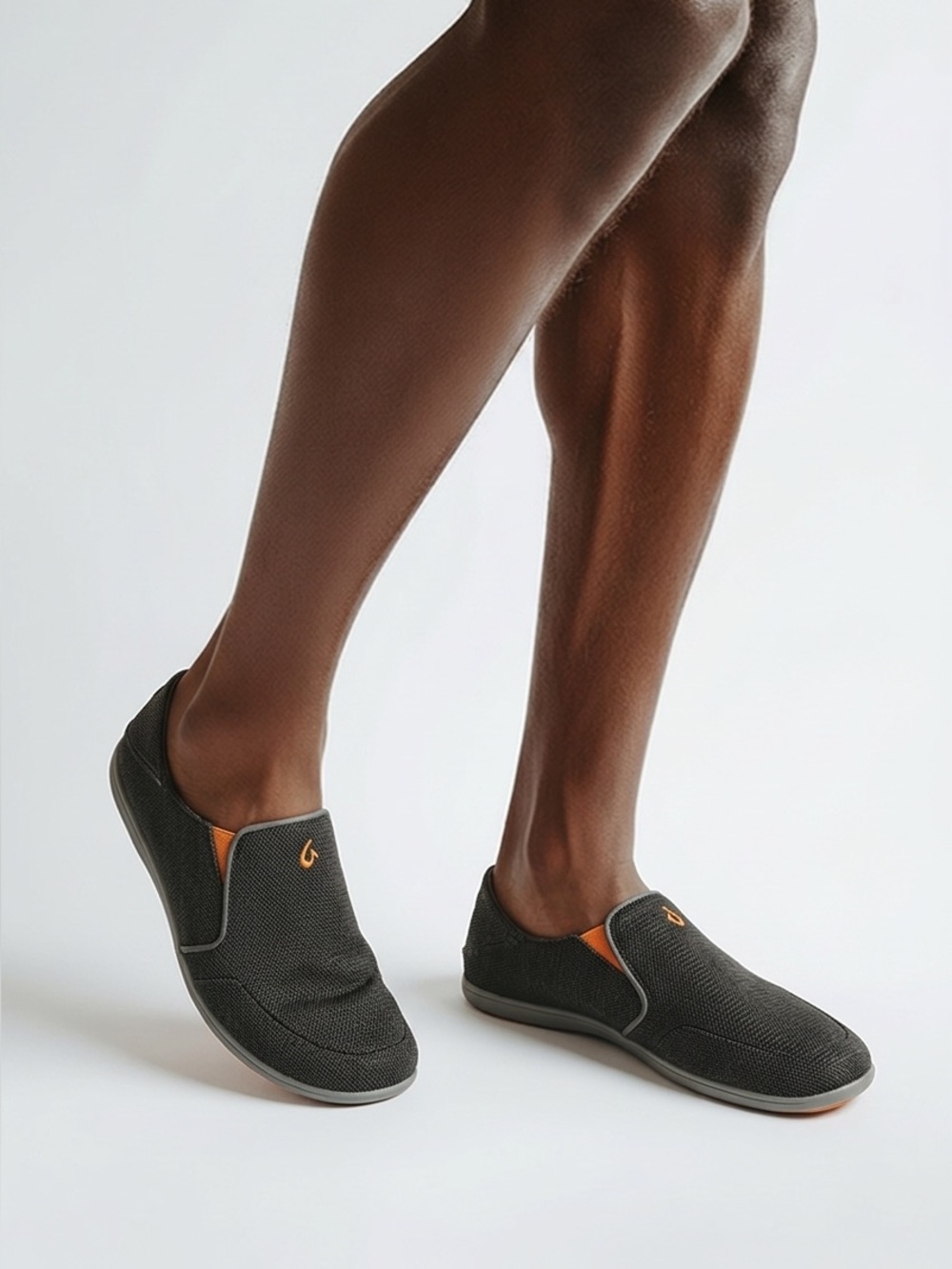OluKai Men's Black Slip-On Loafers with Orange Insole Accents